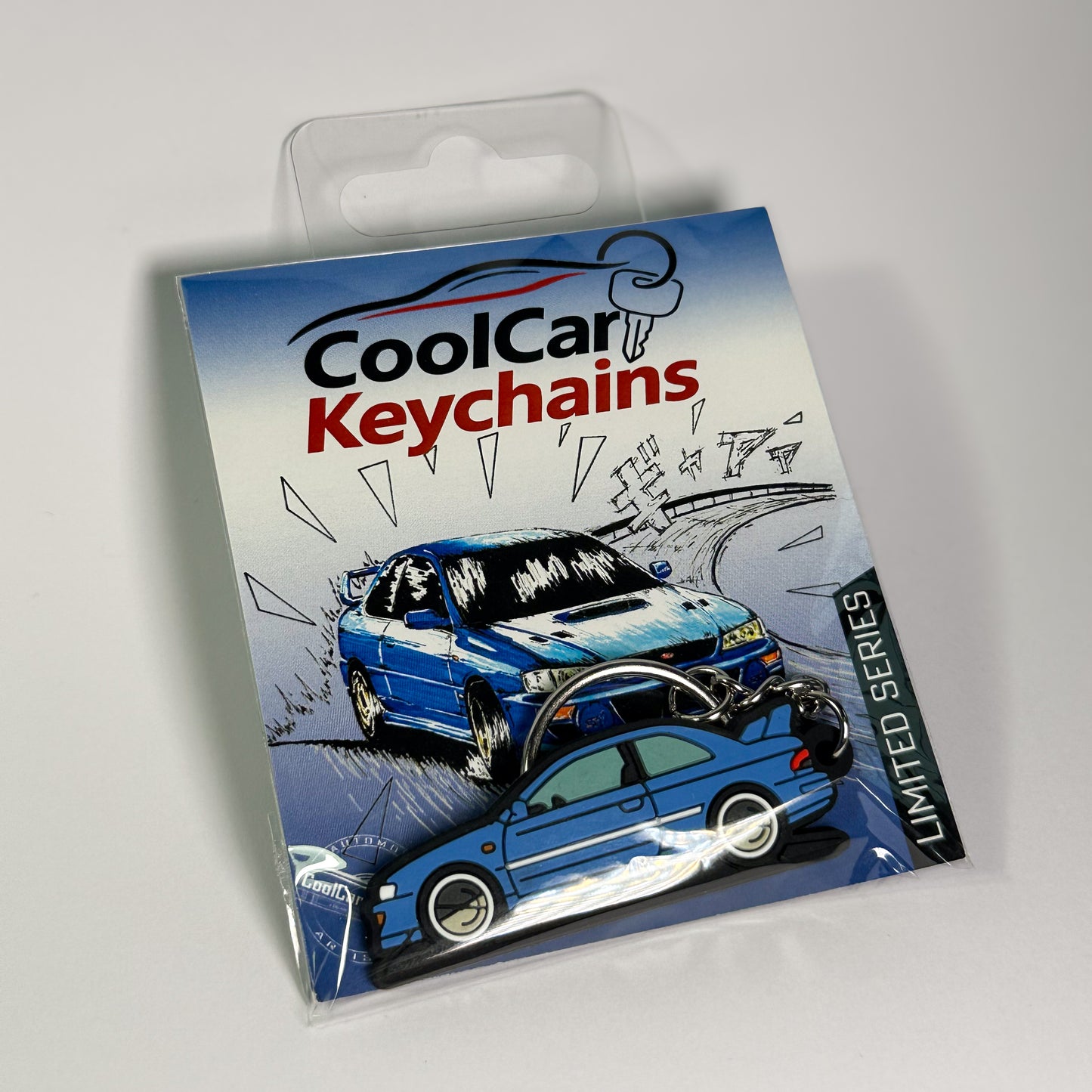 blue subaru 22b keychain in plastic bag, pvc car keychain