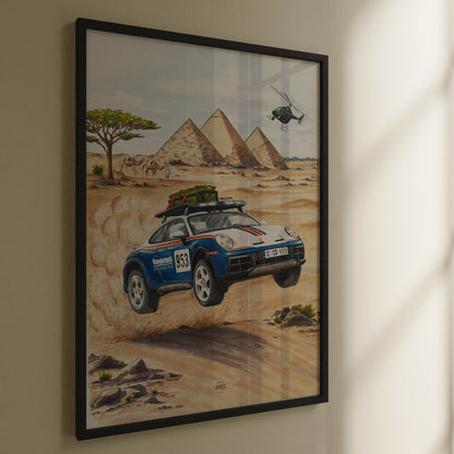 Framed artwork of a Porsche 911 Dakar car in a desert with pyramids and a helicopter.