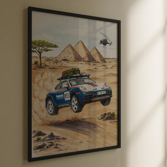 Framed artwork of a Porsche 911 Dakar car in a desert with pyramids and a helicopter.
