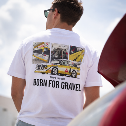 A man viewed from behind wearing a white t-shirt with a large Audi Rally  car print on the back and three smaller detail photos, and the text 'BORN FOR GRAVEL' and 'GROUP B 1985-1986'.
