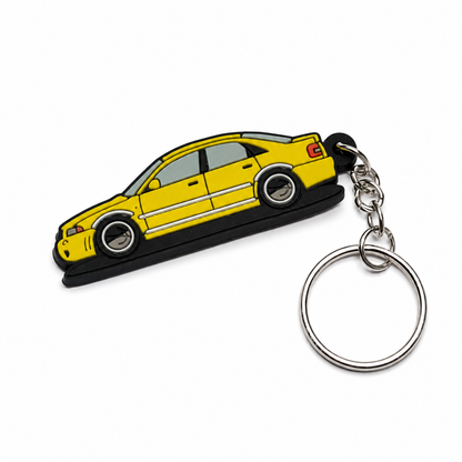 Yellow AUDI A4 car keychain on a white background