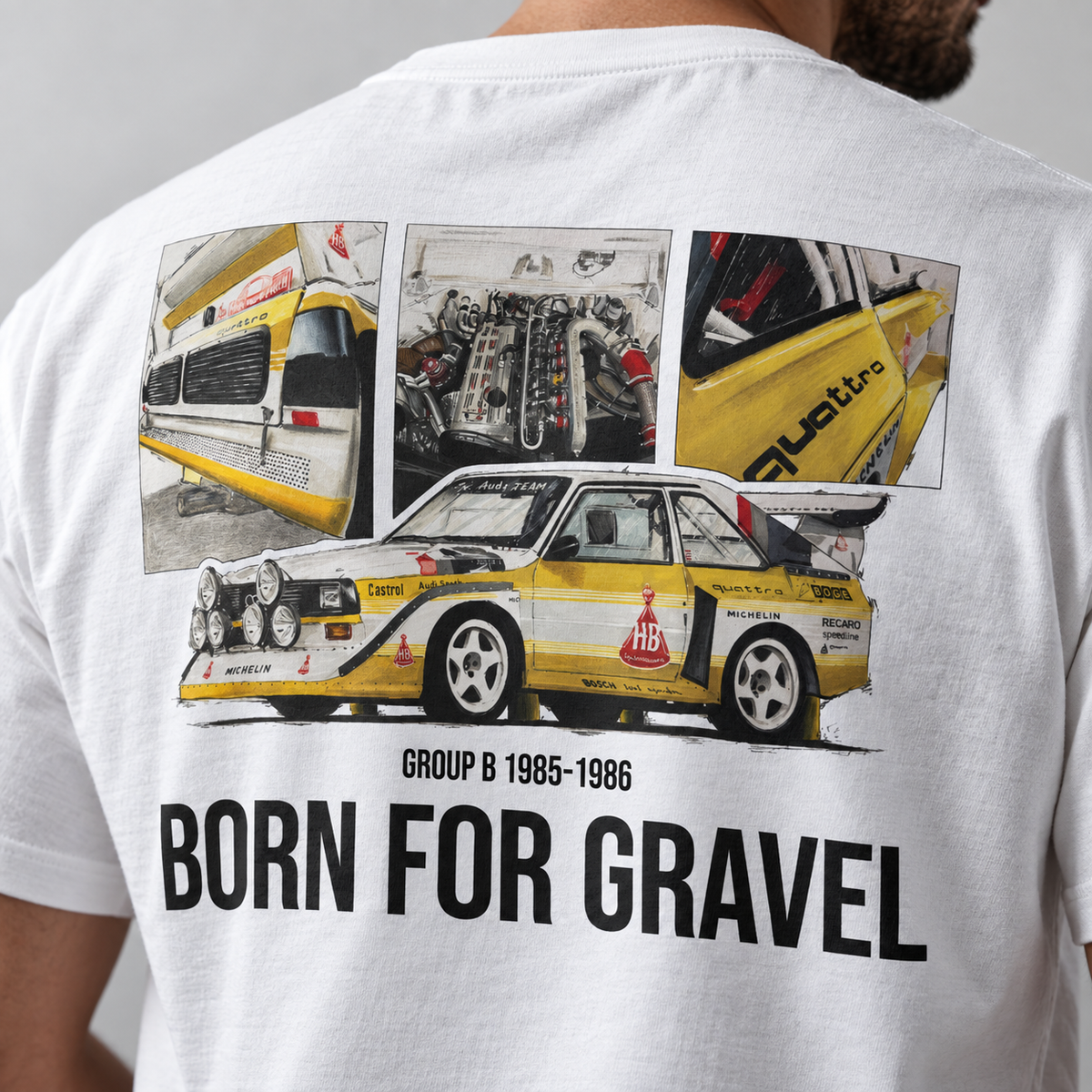 A close-up of a person wearing a white graphic T-shirt, showing the back of the shirt with a large printed design of a Audi Quattro S1 rally car and three car/detail photos above it. The text on the shirt reads 'GROUP B 1985-1986 BORN FOR GRAVEL'.