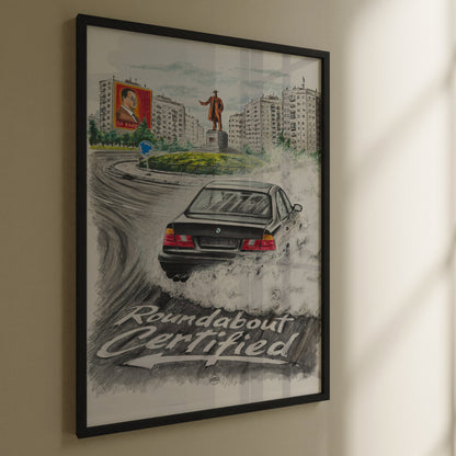 Framed artwork of a bmw e34 poster with text 'Roundabout Certified' on a wall.