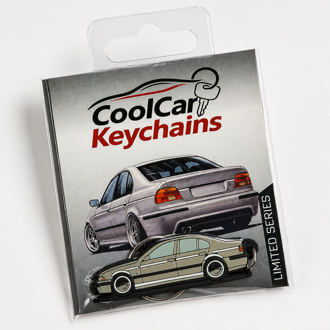 Packaging of CoolCar Keychains with grey BMW E39 keychain on a white background