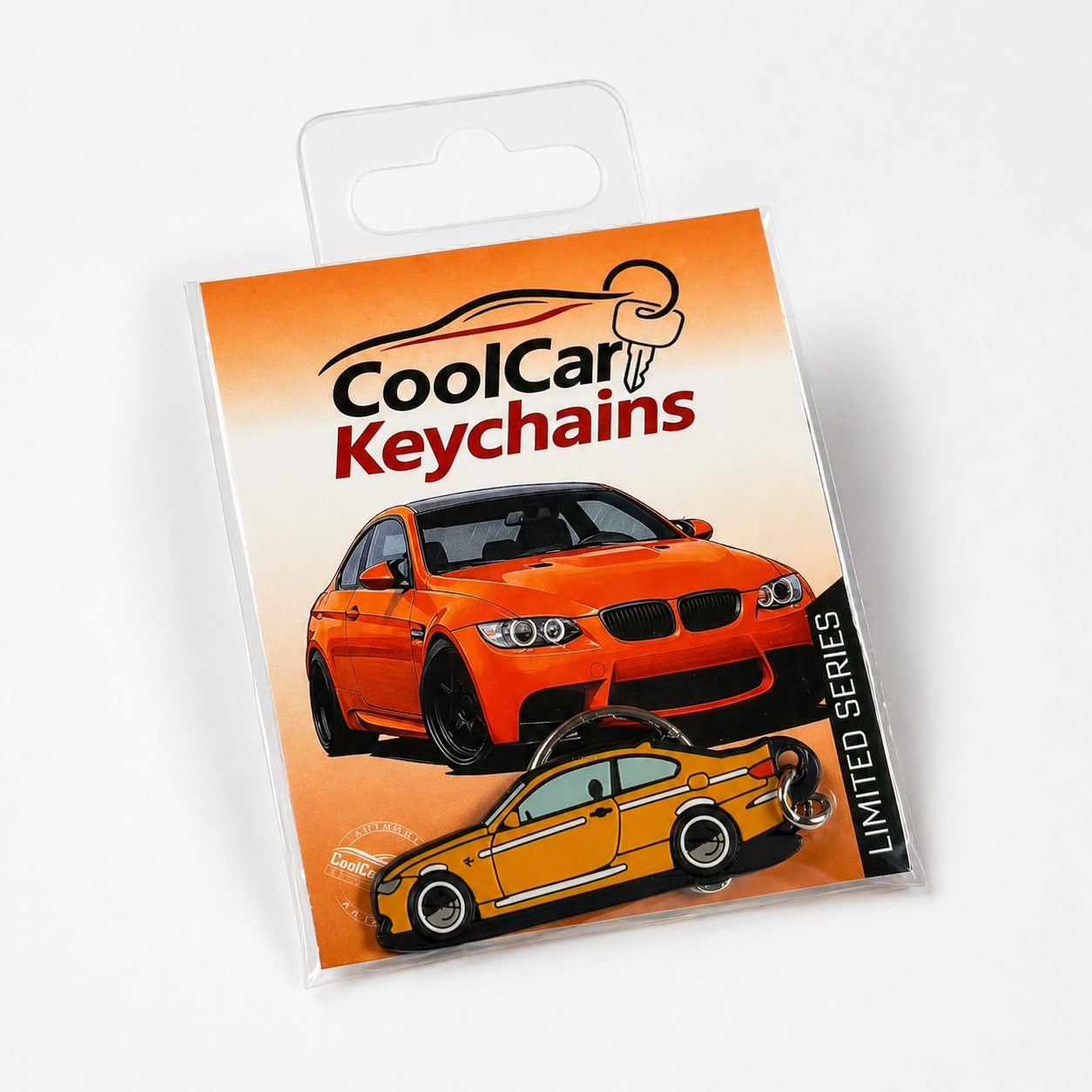 Packaging of CoolCar Keychains with an orange BMW E92 keychain on a white background