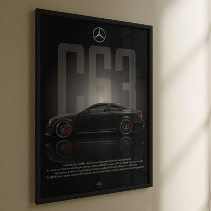 Framed poster of a Mercedes-Benz C63 on a wall