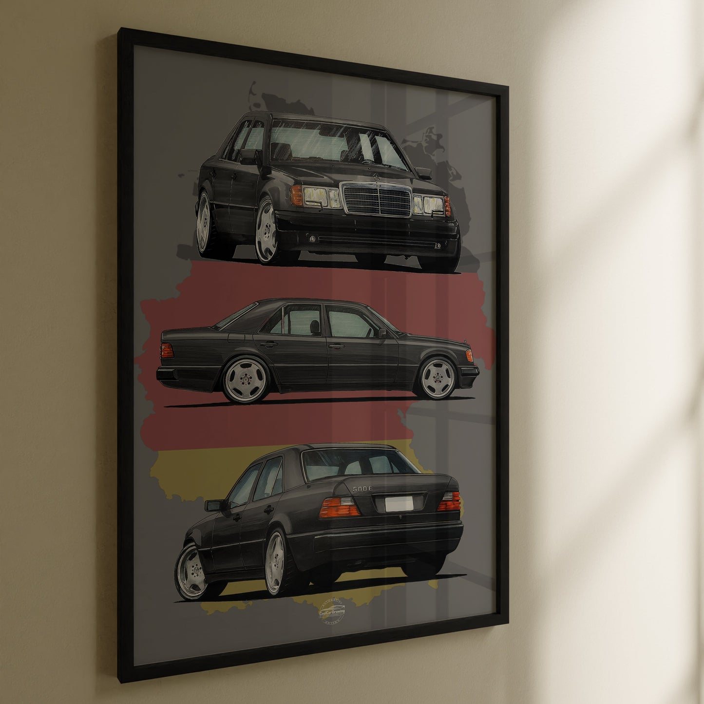 Framed artwork of three Mercedes-Benz W124 cars on a wall.