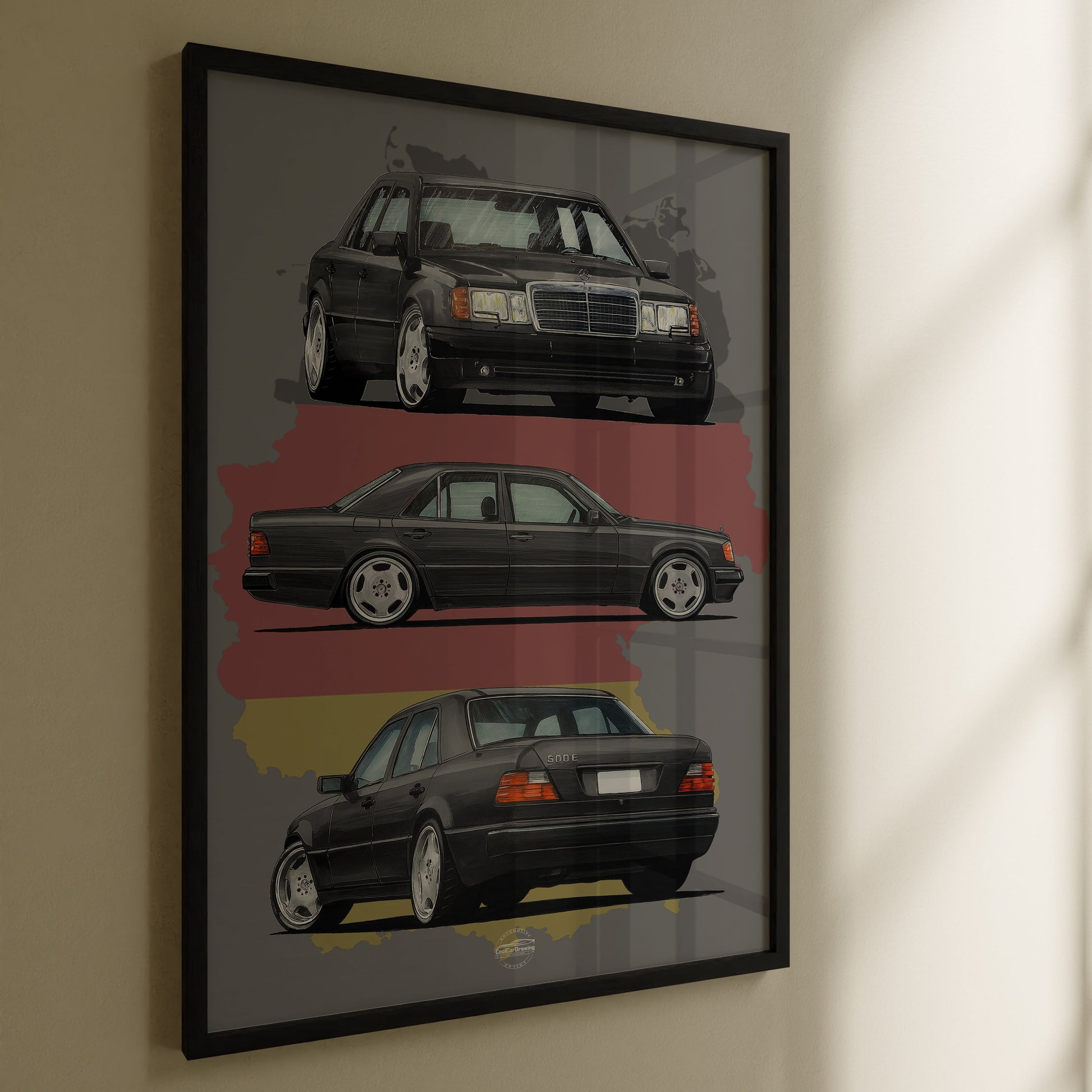 Framed artwork of three Mercedes-Benz W124 cars on a wall.