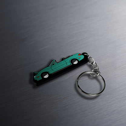 miata keychain on table