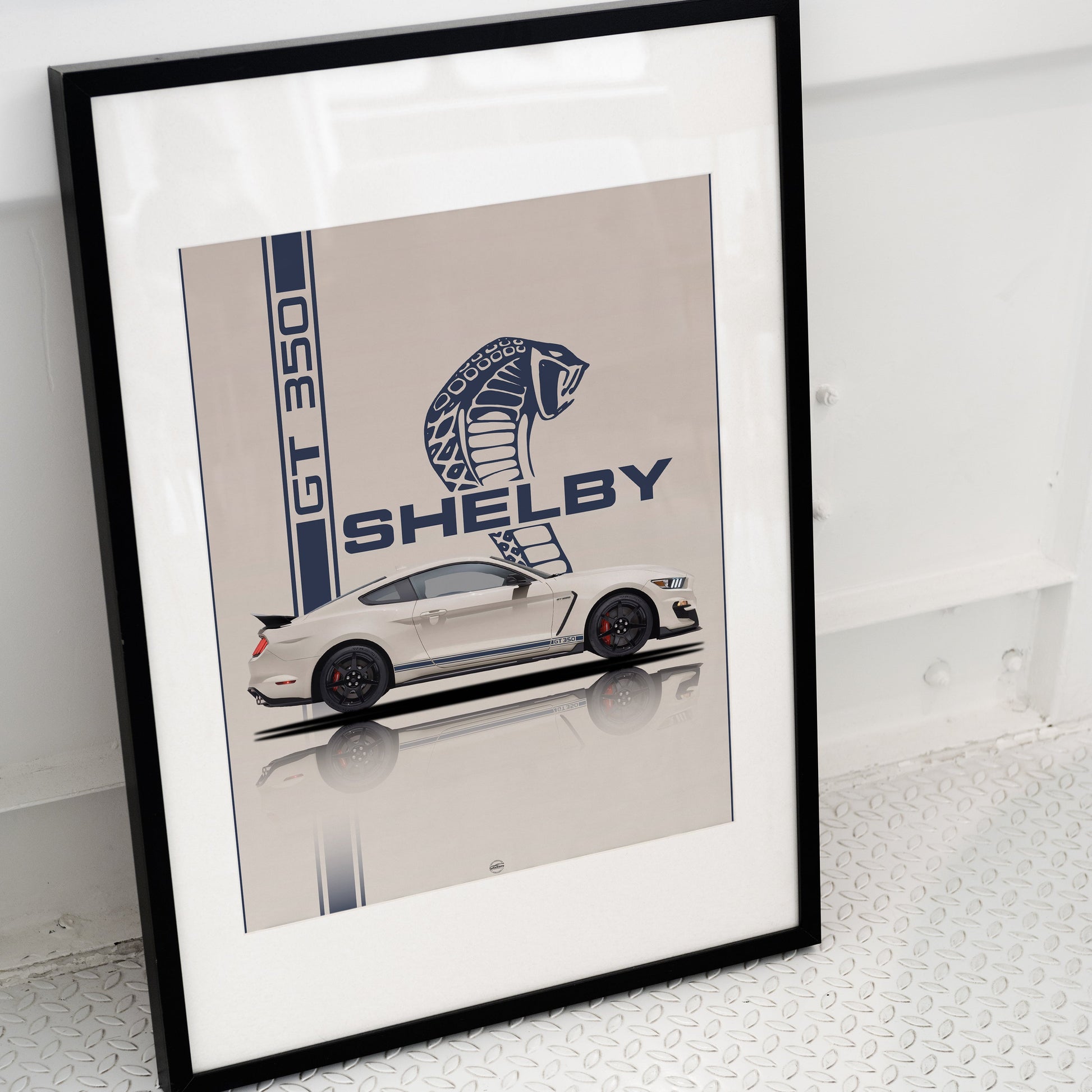 Framed artwork of a Shelby car design on a white surface