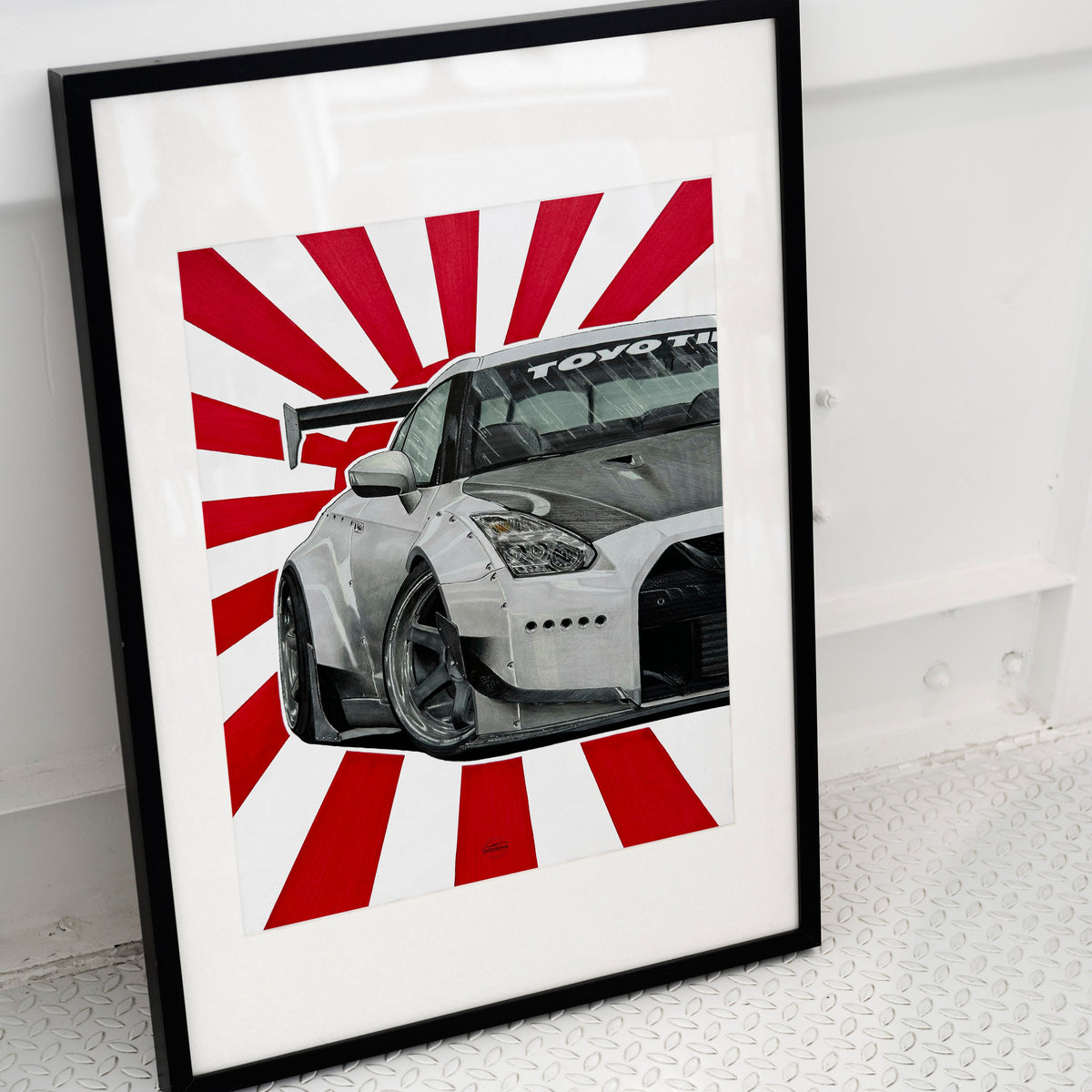 JDM drawing of Nissan Skyline R35 placed on ground in black frame