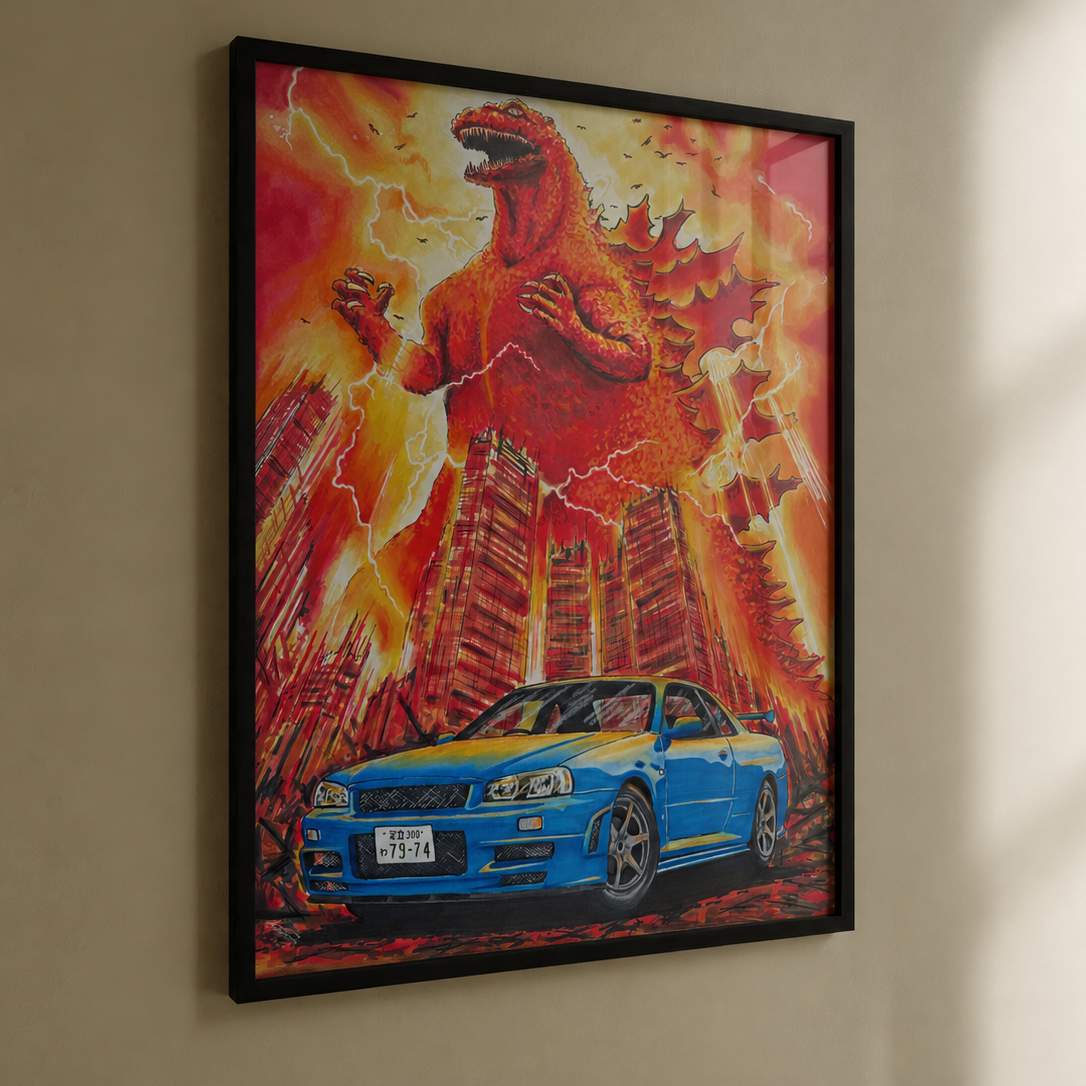 A framed art print hanging on a beige wall, featuring a blue Nissan Skyline R34 with Godzilla over a skyline in the background. The artwork is in a black frame and photographed in a real interior 