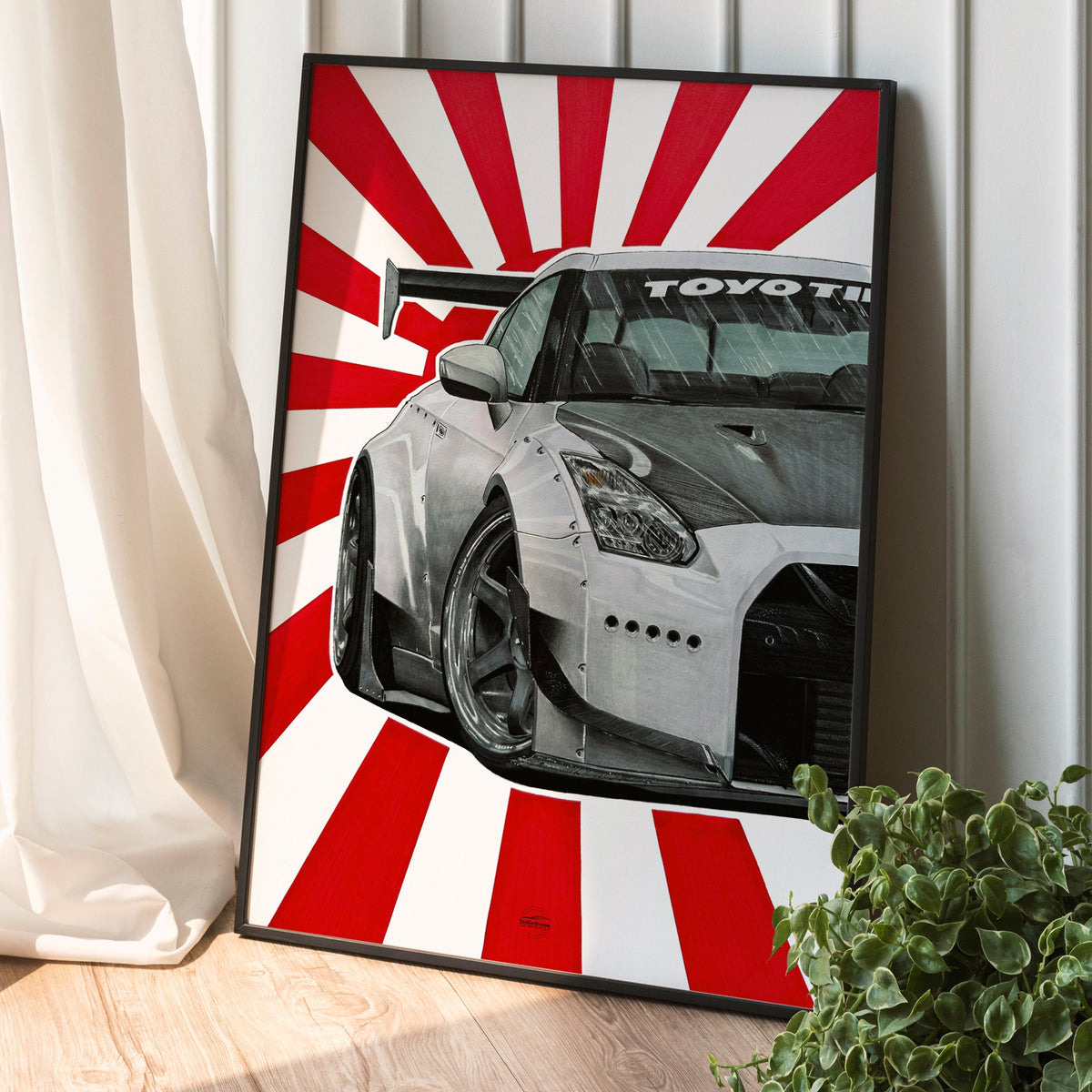 Nissan Skyline R35 drawing in black frame placed on floor